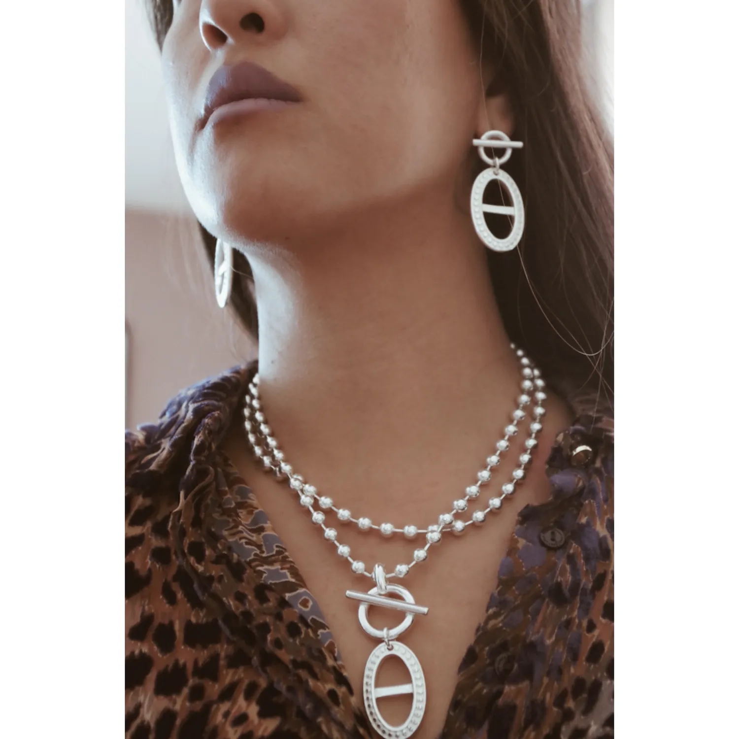 Secret de Cuir N°1318 boucles d'oreilles ovale barre argent