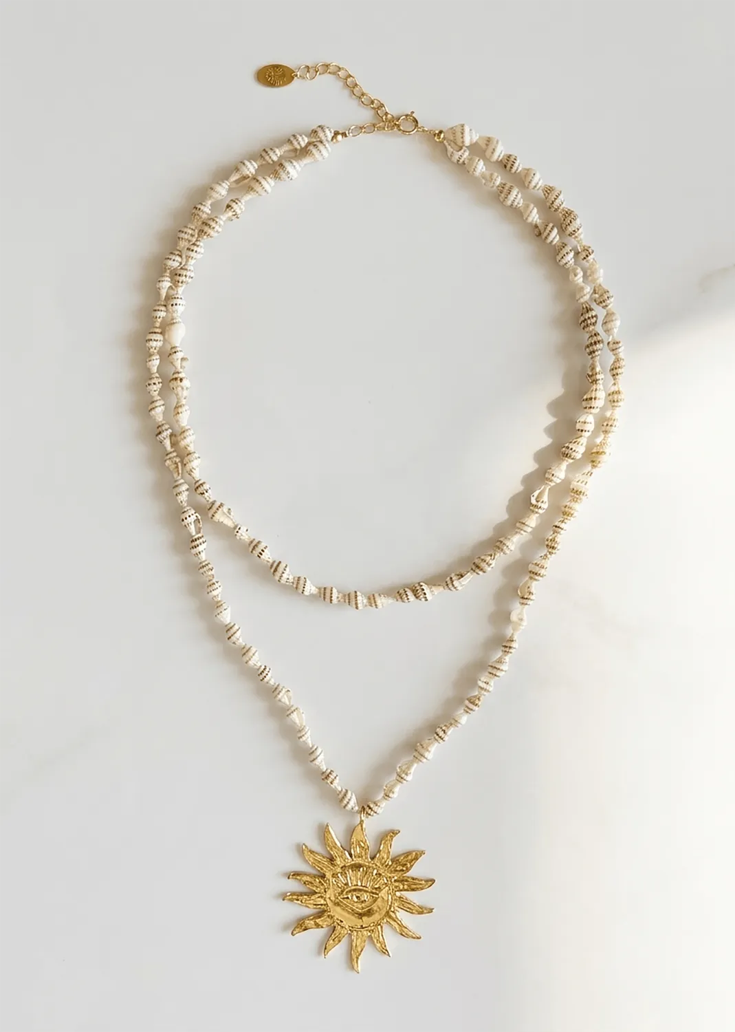 Elise Tsikis Helios Mykonos collier coquillages soleil